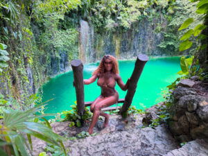Attractive sensual masseuse at a cenote in Tulum
